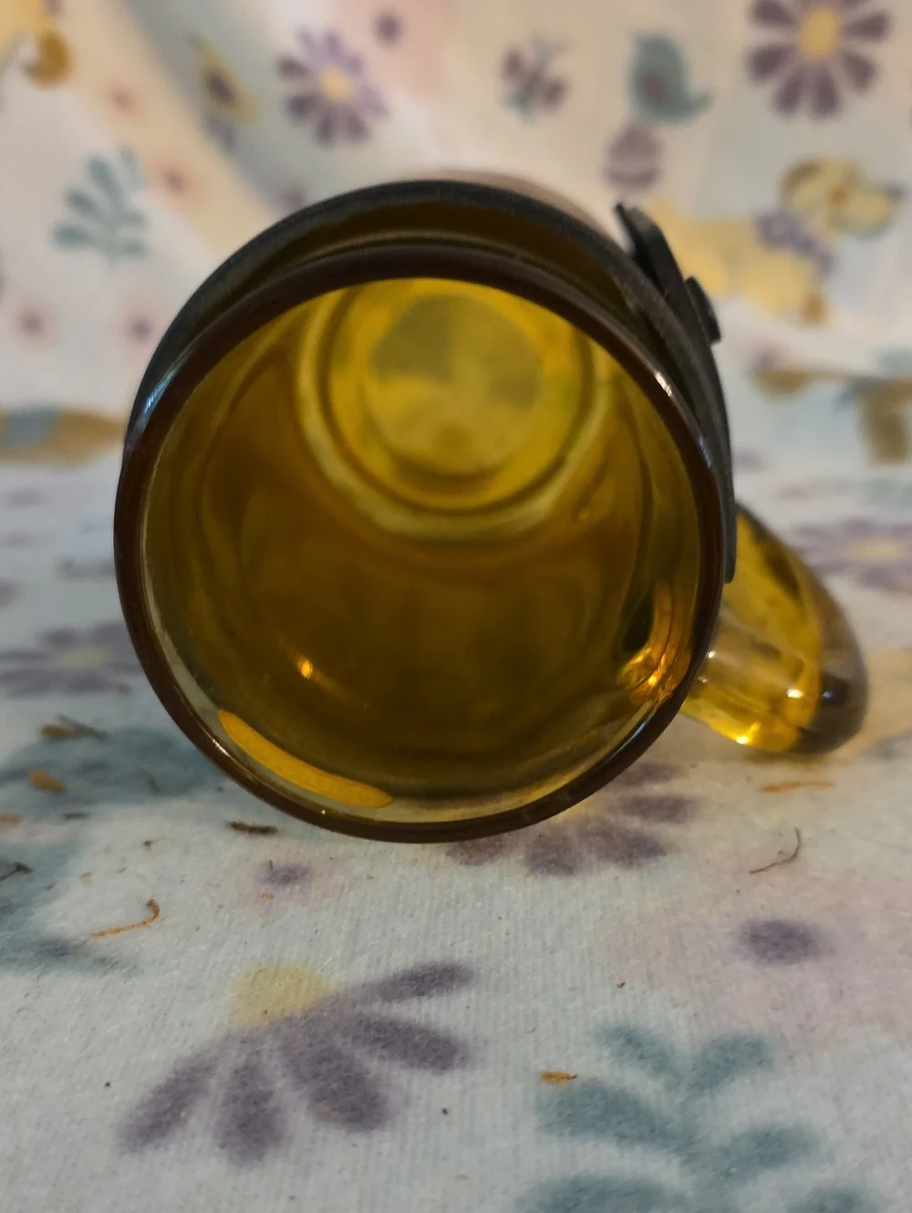 Vintage amber glass beer mug featuring a fitted brown leather wrap